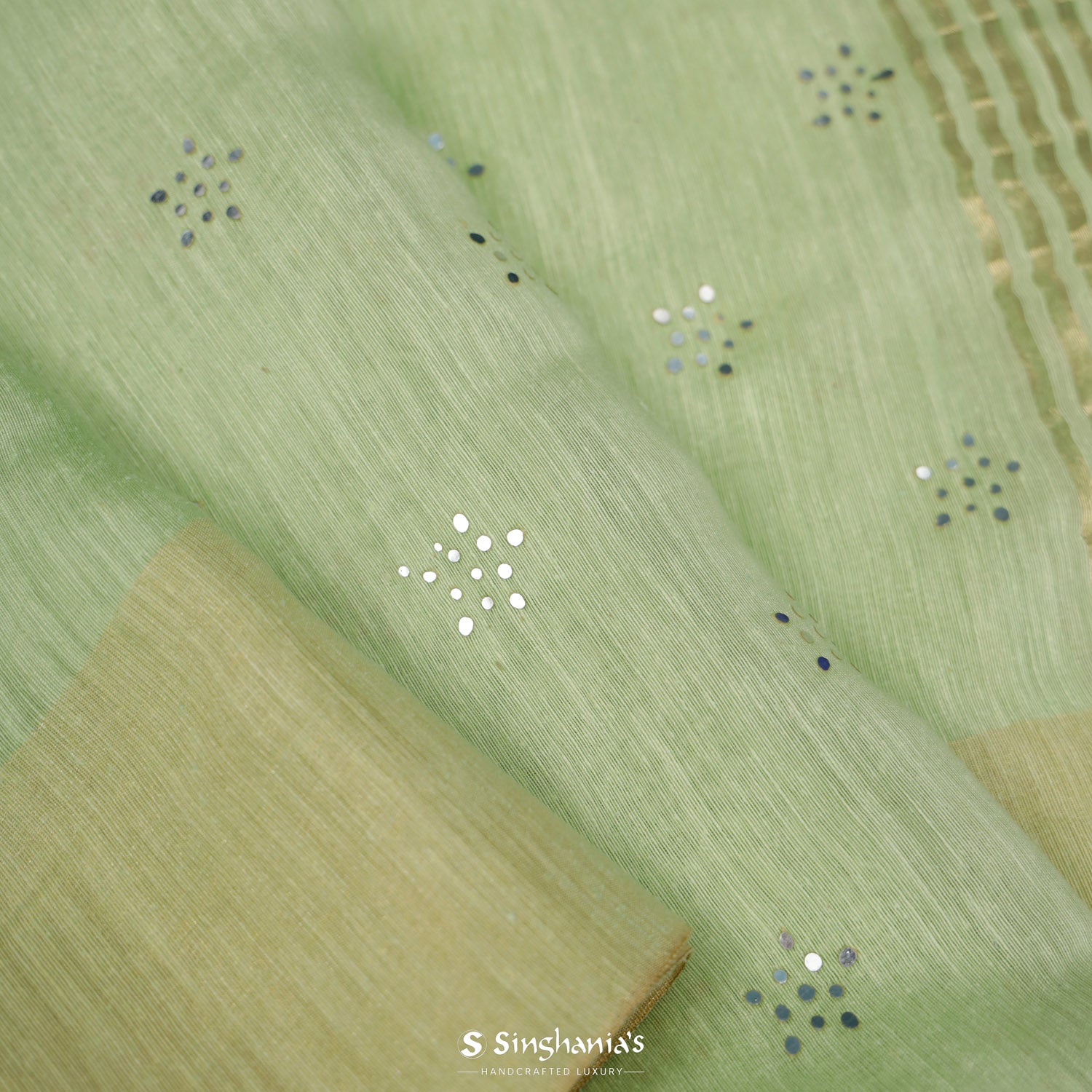 Tea Green Linen Saree With Mukaish Work In Floral Butti Pattern