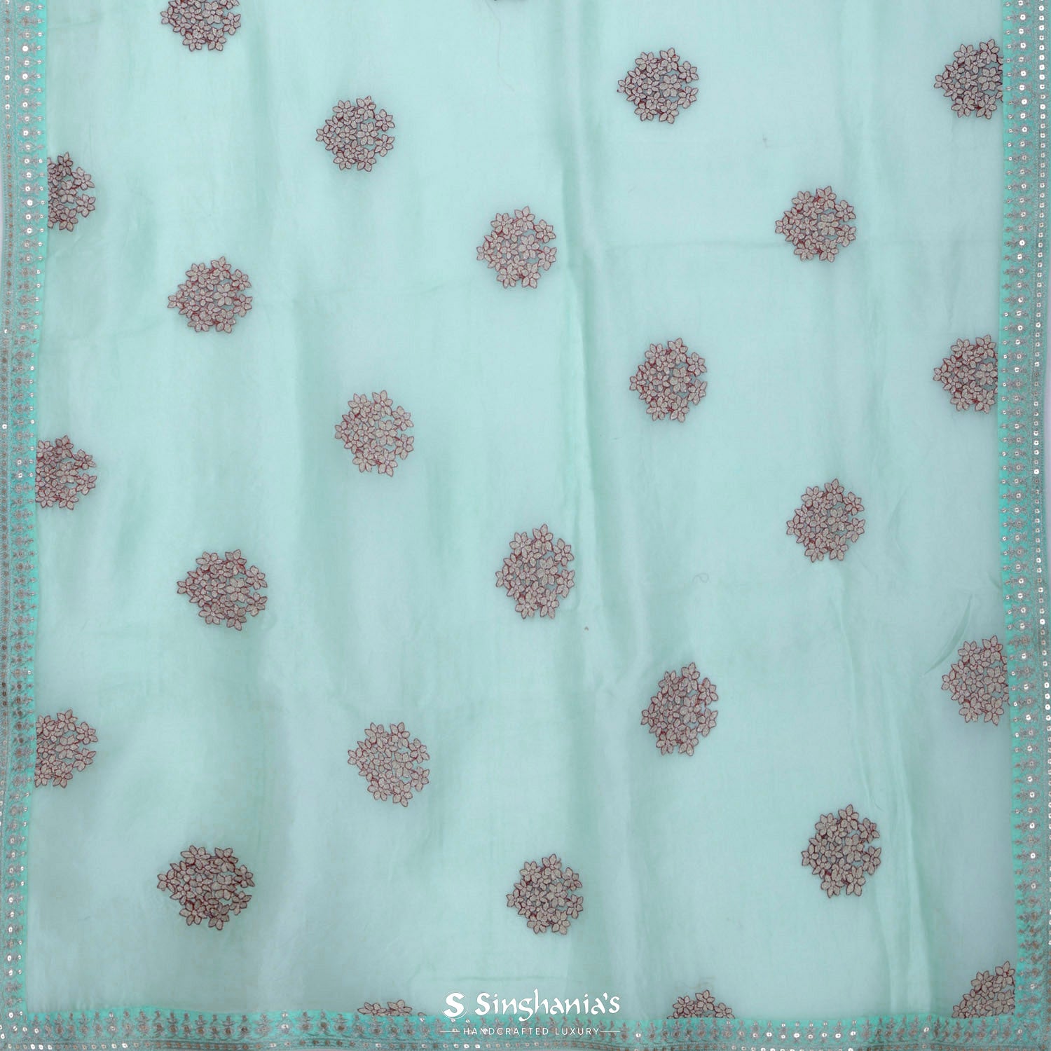 Light Turquoise Blue Organza Saree With Floral Buttis