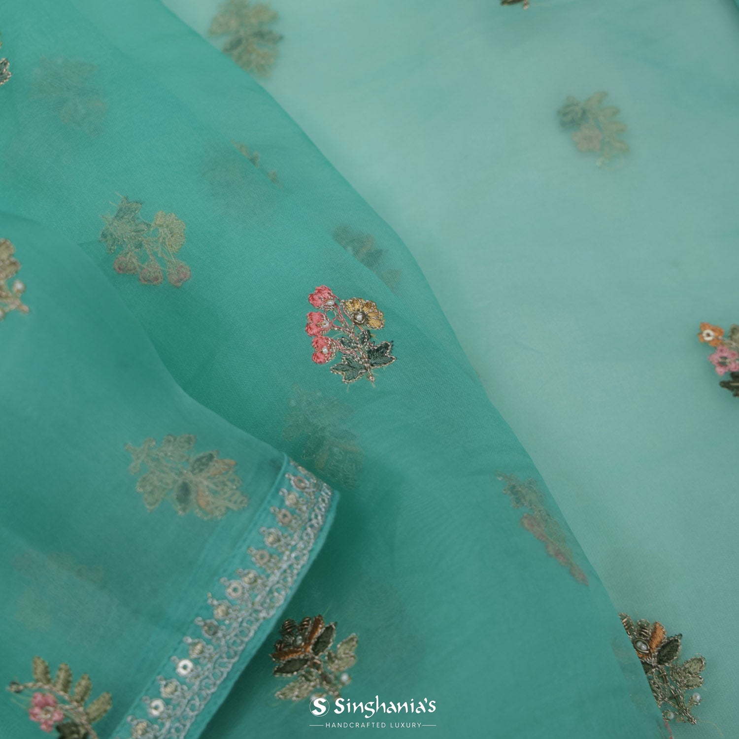 Medium Turquoise Blue Organza Saree With Floral Buttis