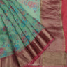 Turquoise Green Printed Organza Saree With Floral Pattern