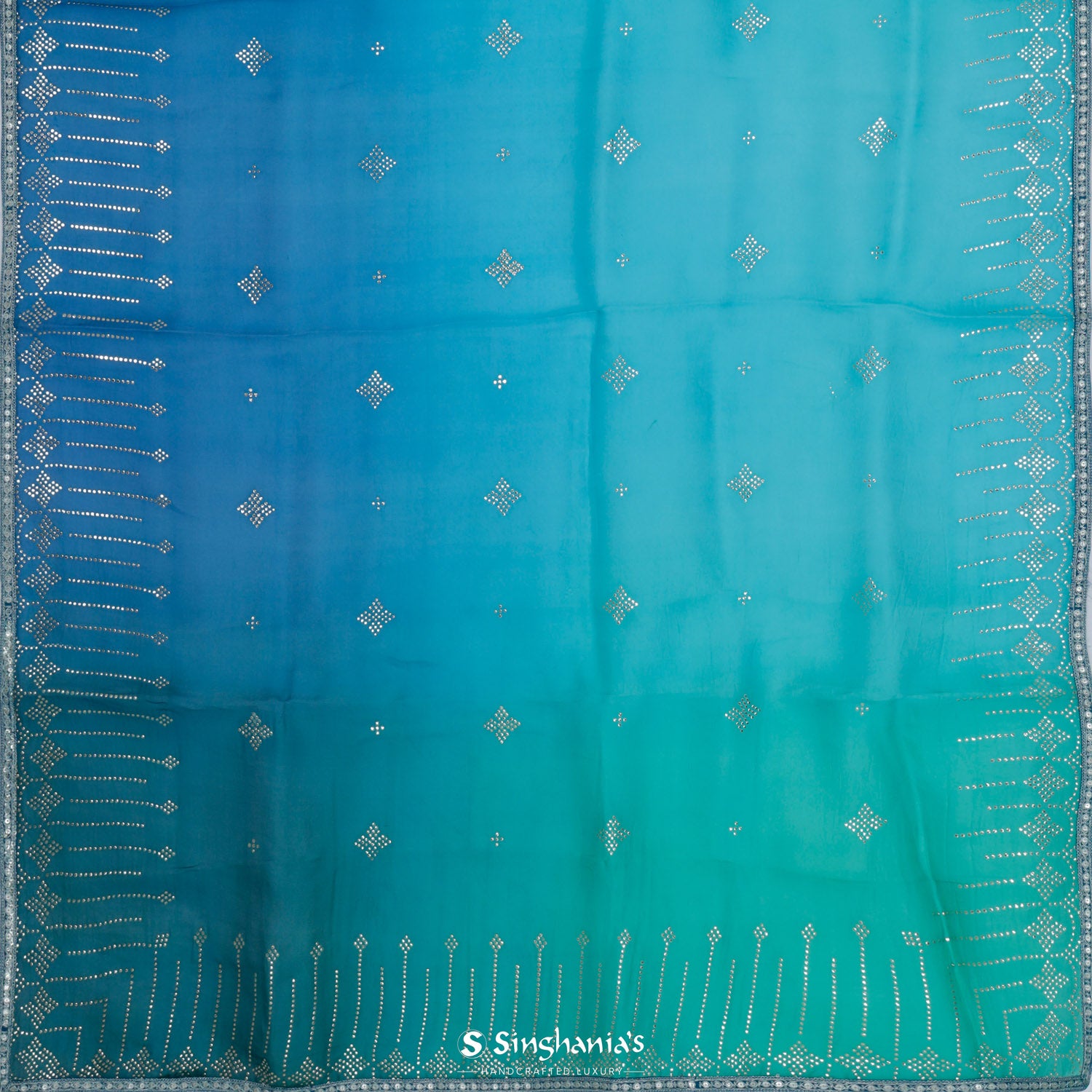 Shades Of Blue Organza Saree With Mukaish Work In Abstract Pattern