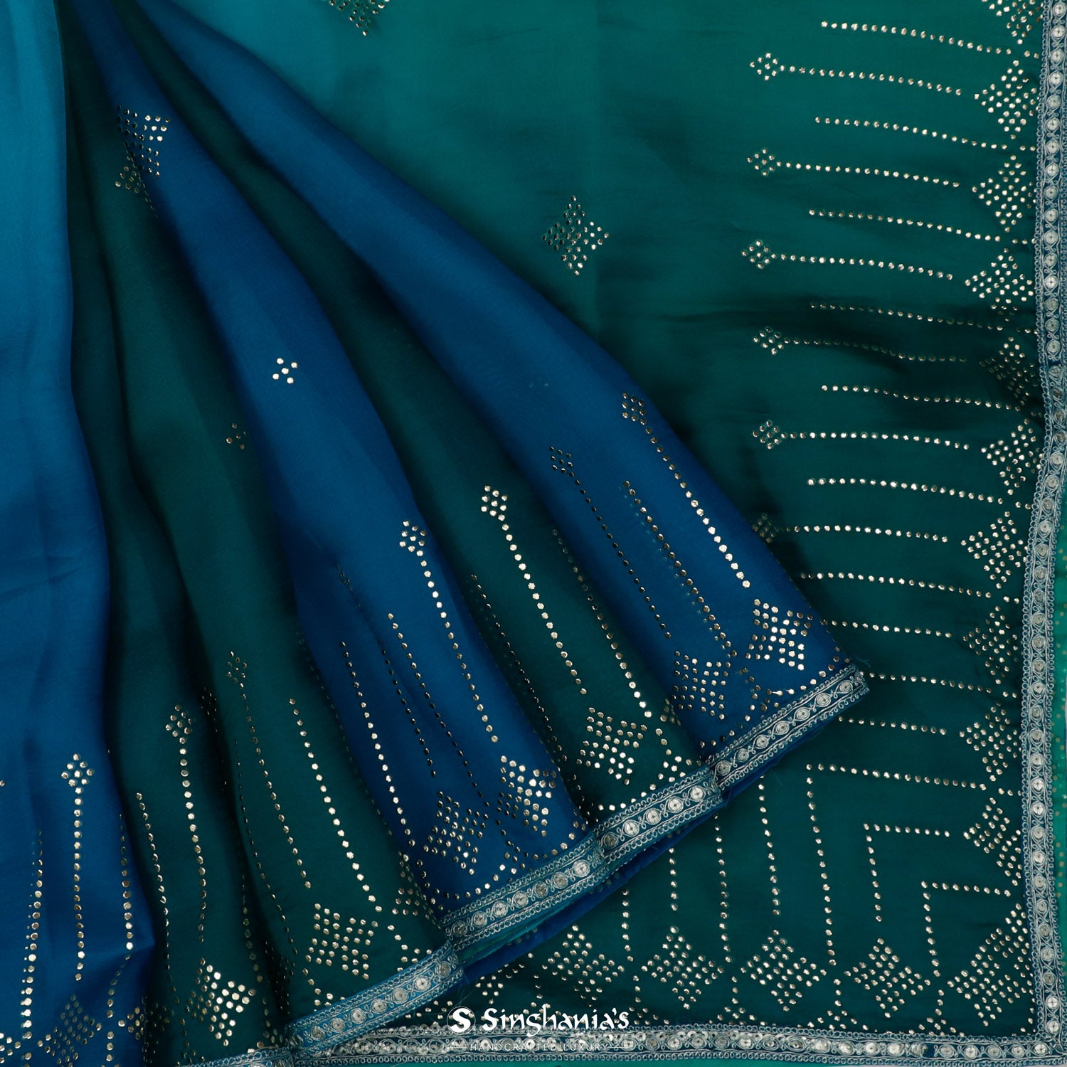 Shades Of Blue Organza Saree With Mukaish Work In Abstract Pattern