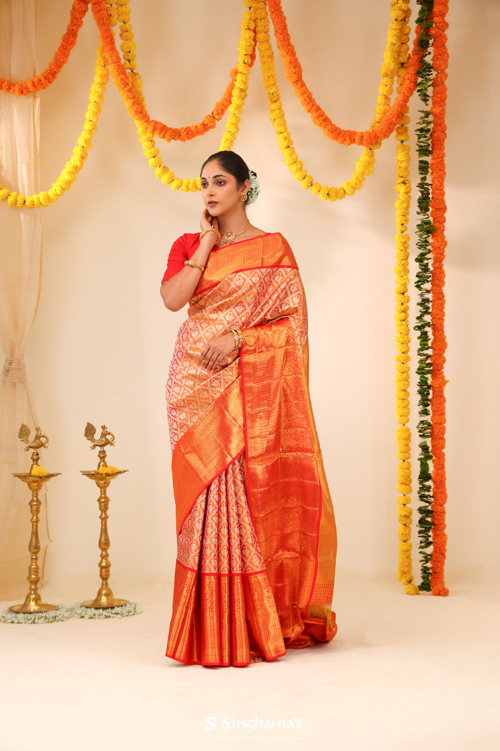 Metallic Orange Tissue Kanjivaram Saree With Floral Weaving