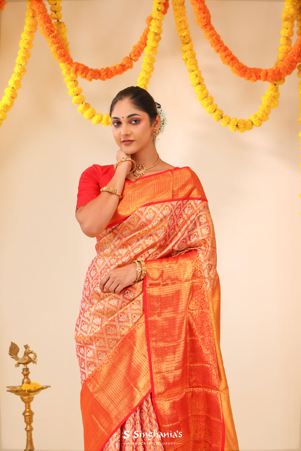 Metallic Orange Tissue Kanjivaram Saree With Floral Weaving