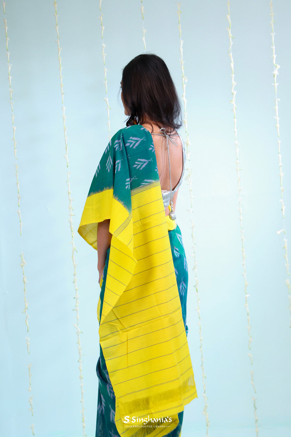 Peacock Green Ikkat Cotton Saree With Contrast Border