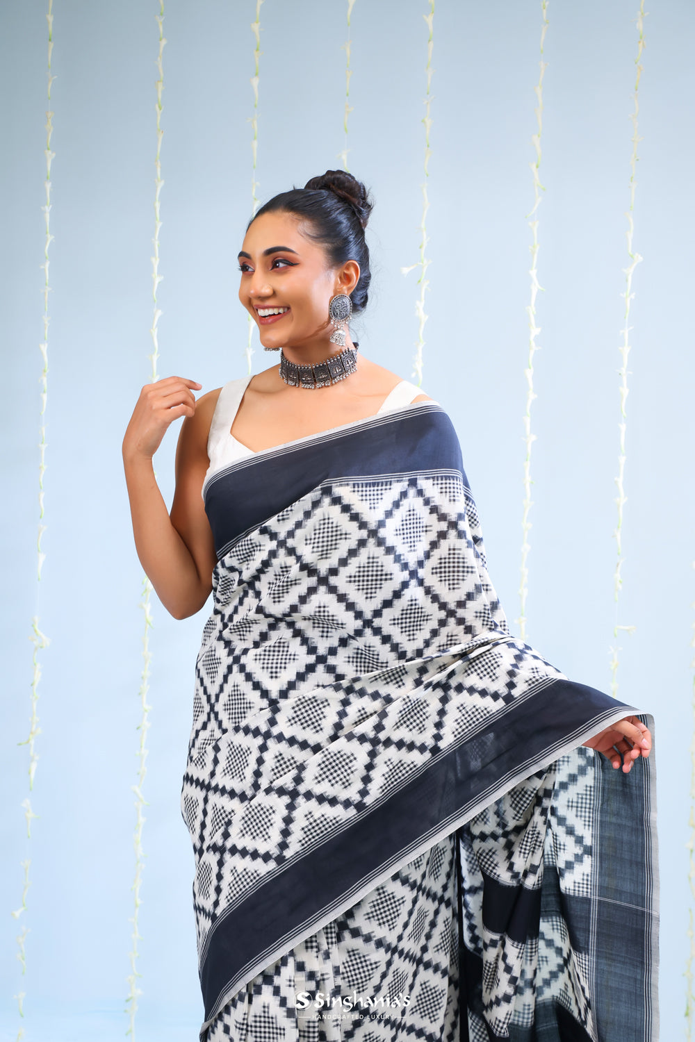 Merino White Ikkat Cotton Saree With Black Pattern