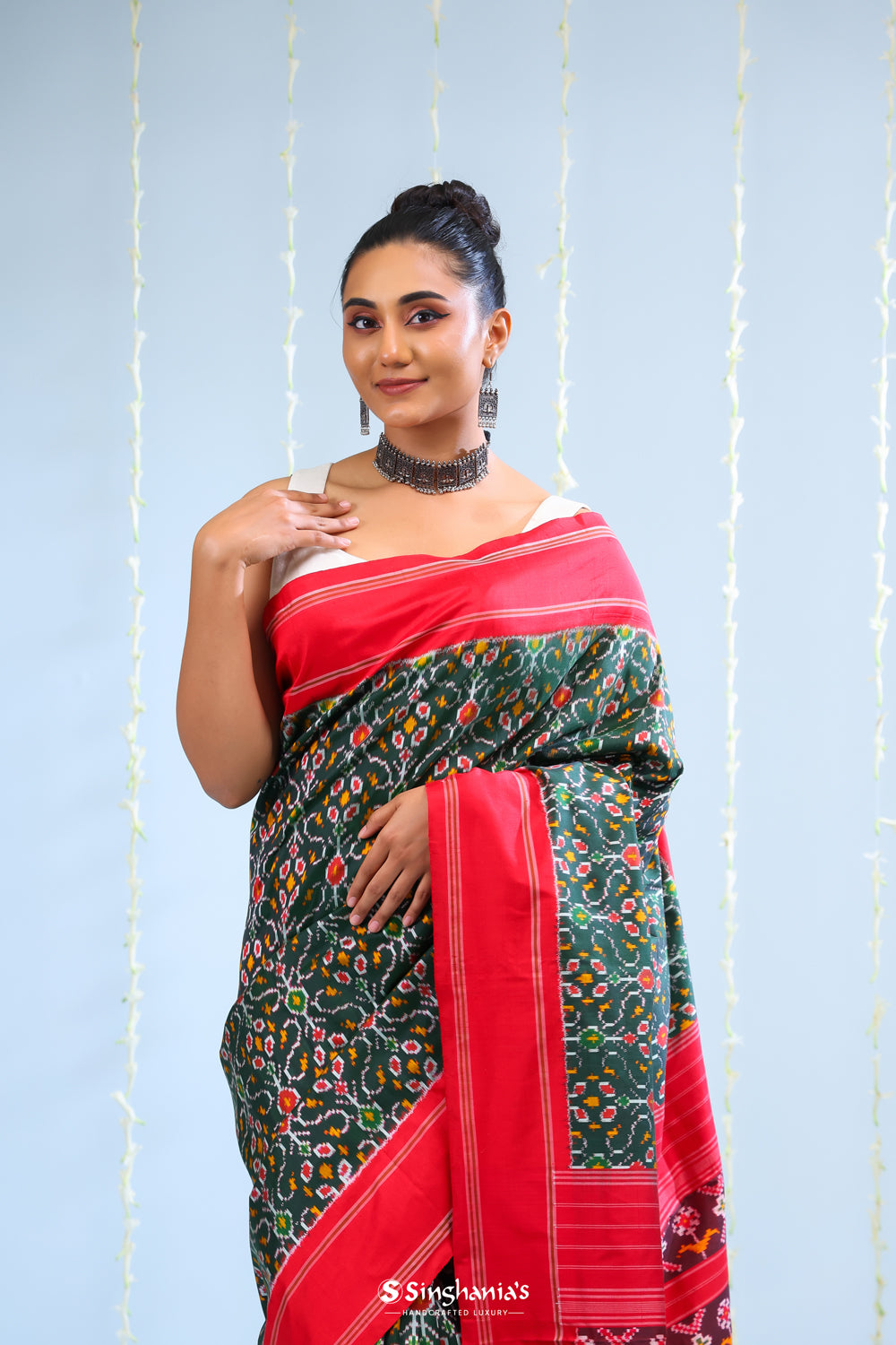 Kaitoke Green Ikkat Silk Saree With Contrast Border