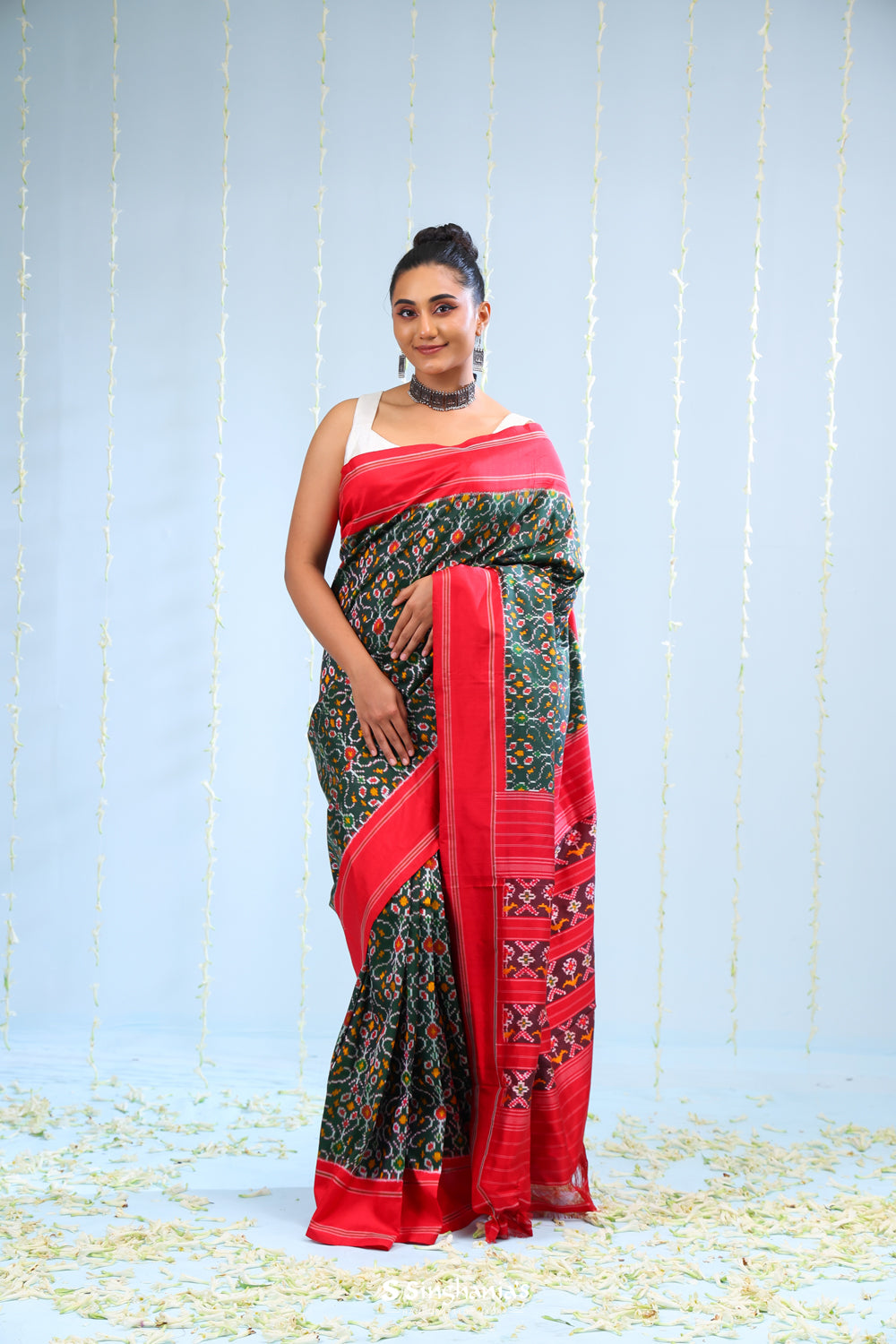 Kaitoke Green Ikkat Silk Saree With Contrast Border