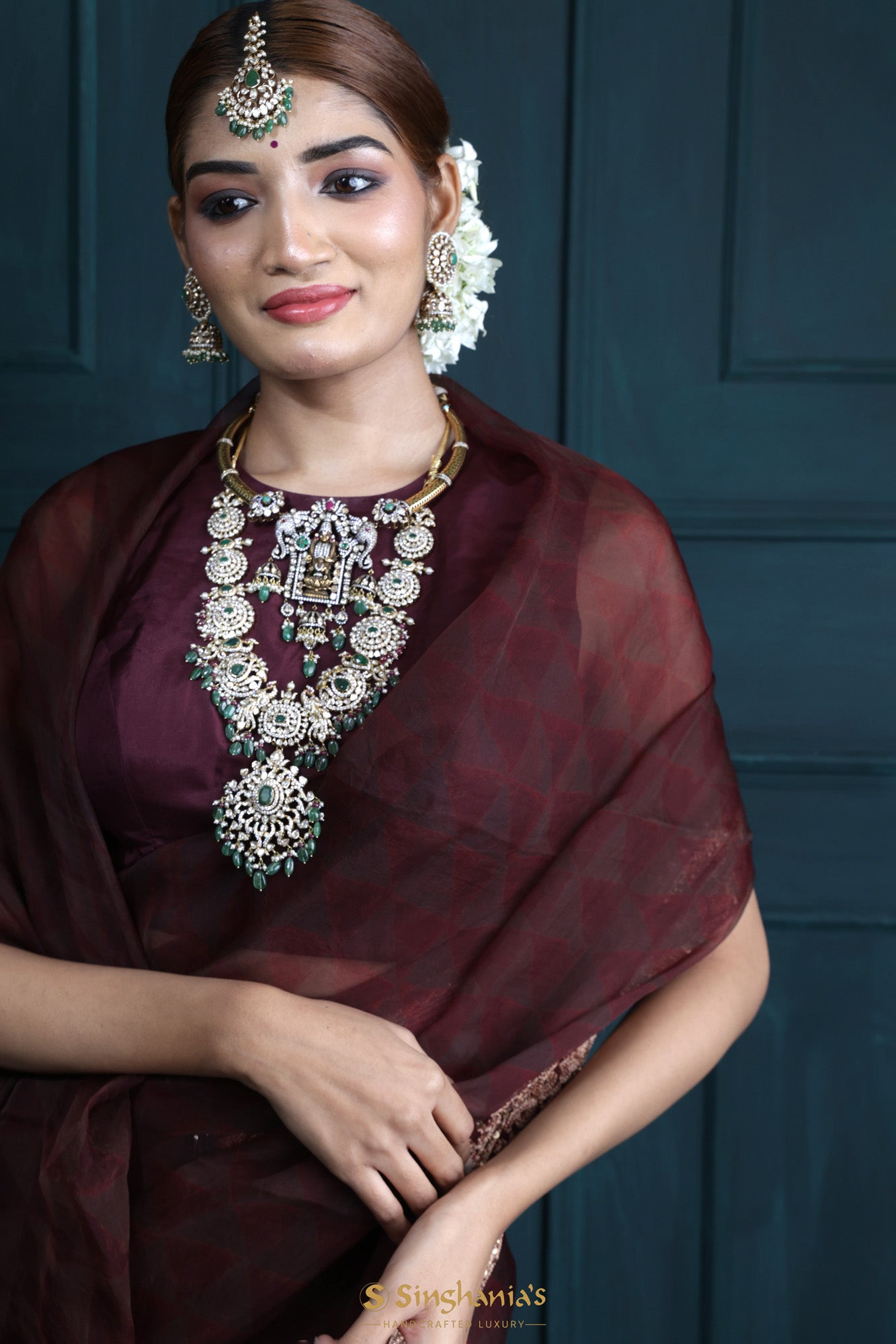 Rekha in a maroon kanjeevaram saree – South India Fashion