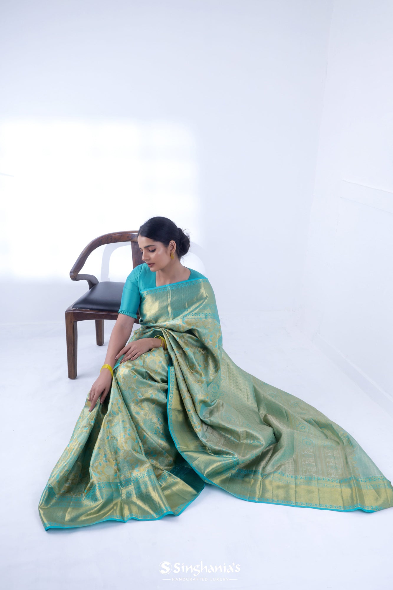 Olive Green Kanjivaram Silk Saree With Floral Design Weaving