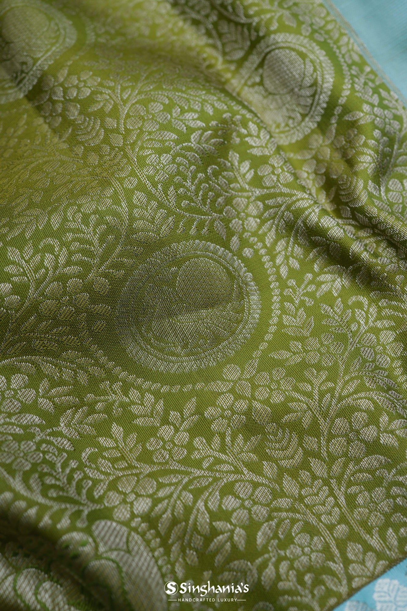 Olive Green Kanjivaram Silk Saree With Mayil Chakra And Floral Weaving