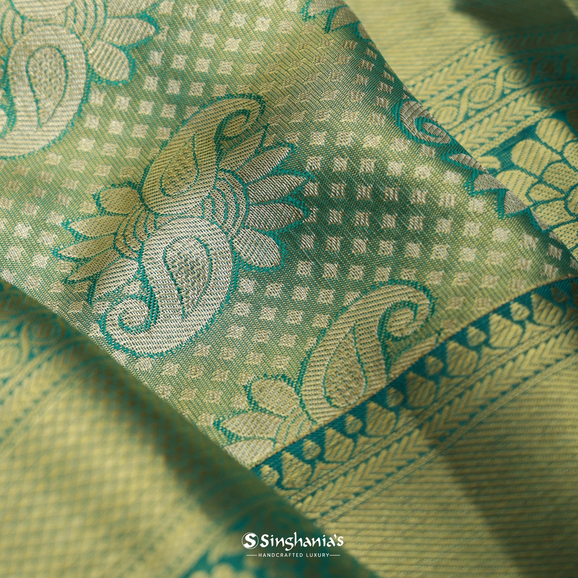 Pastel Olive Green Kanjivaram Silk Saree With Floral Paisley Weaving
