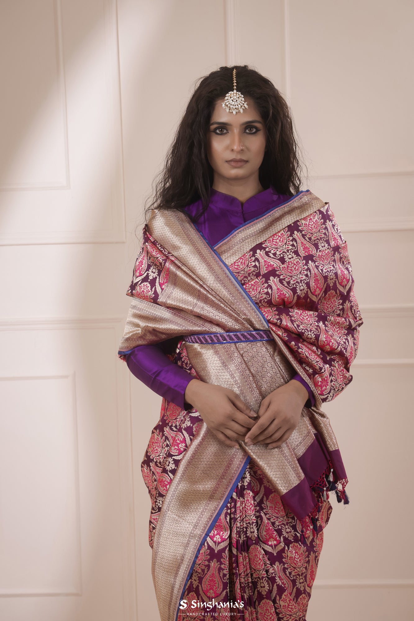 Maroon banarasi silk saree with golden belt
